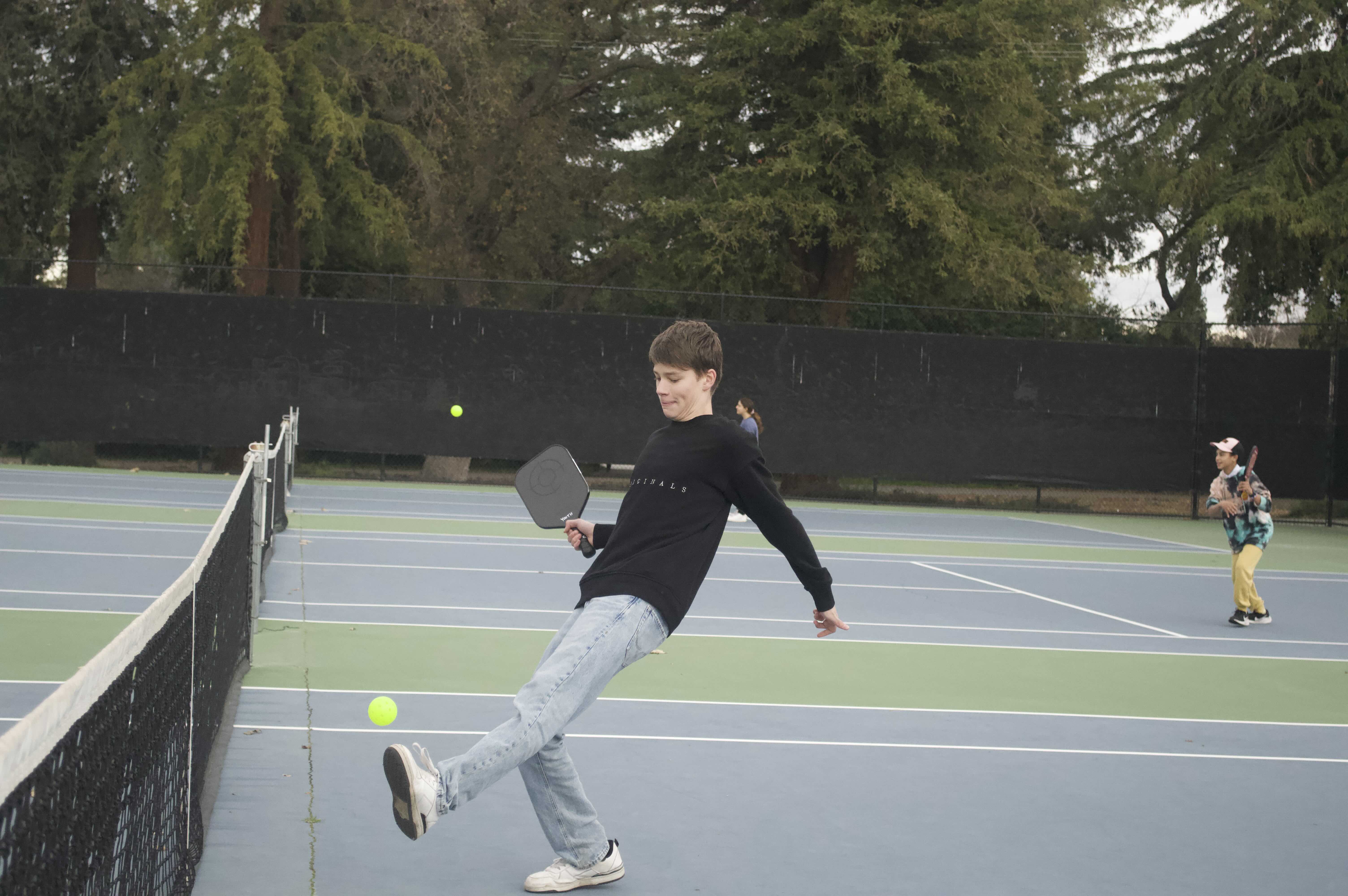 Jacob giving it his all with a kick to keep the ball off the floor—rules might have a thing to say about it! (Jan 2024)